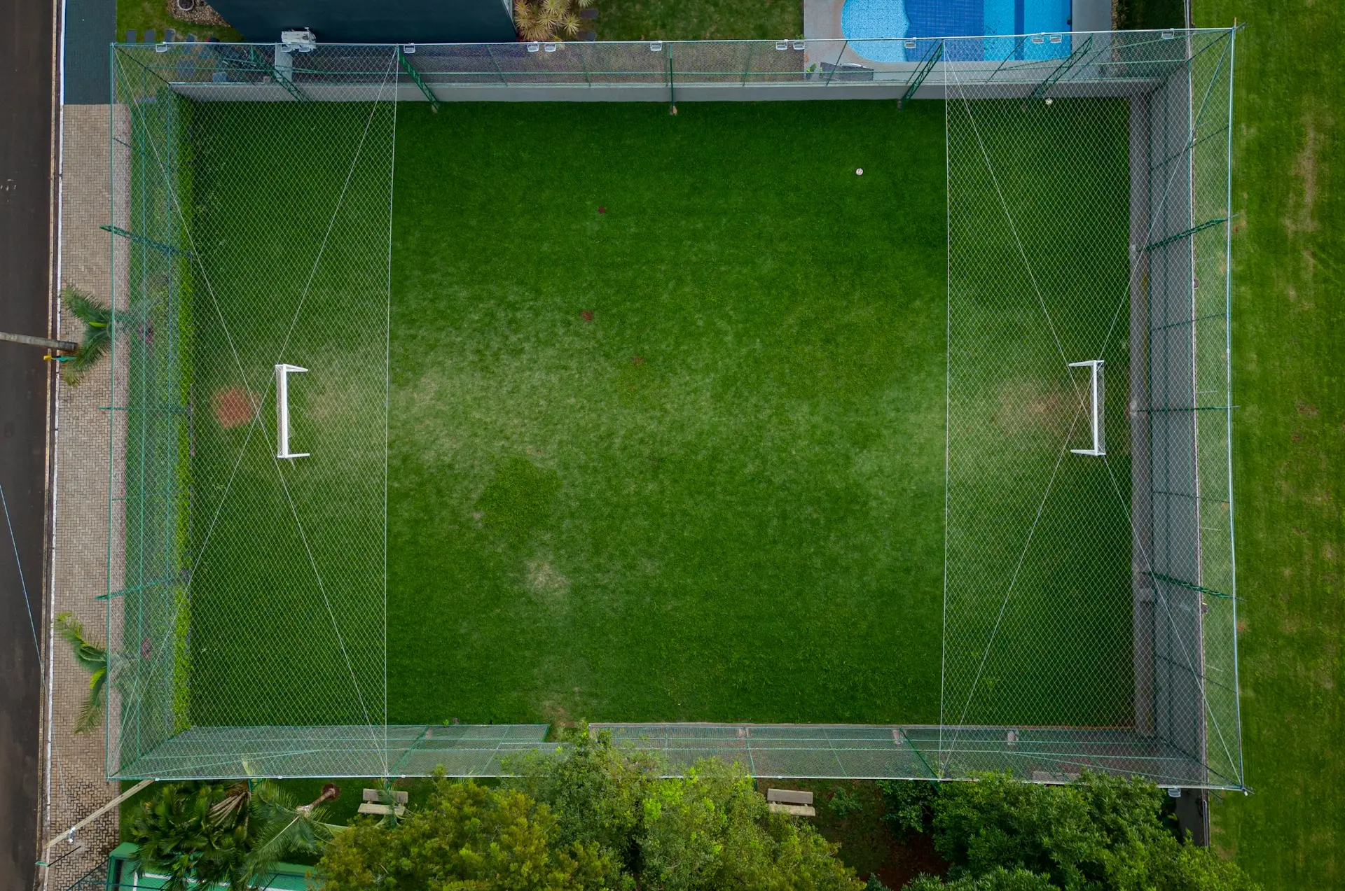 an aerial view of a green soccer field