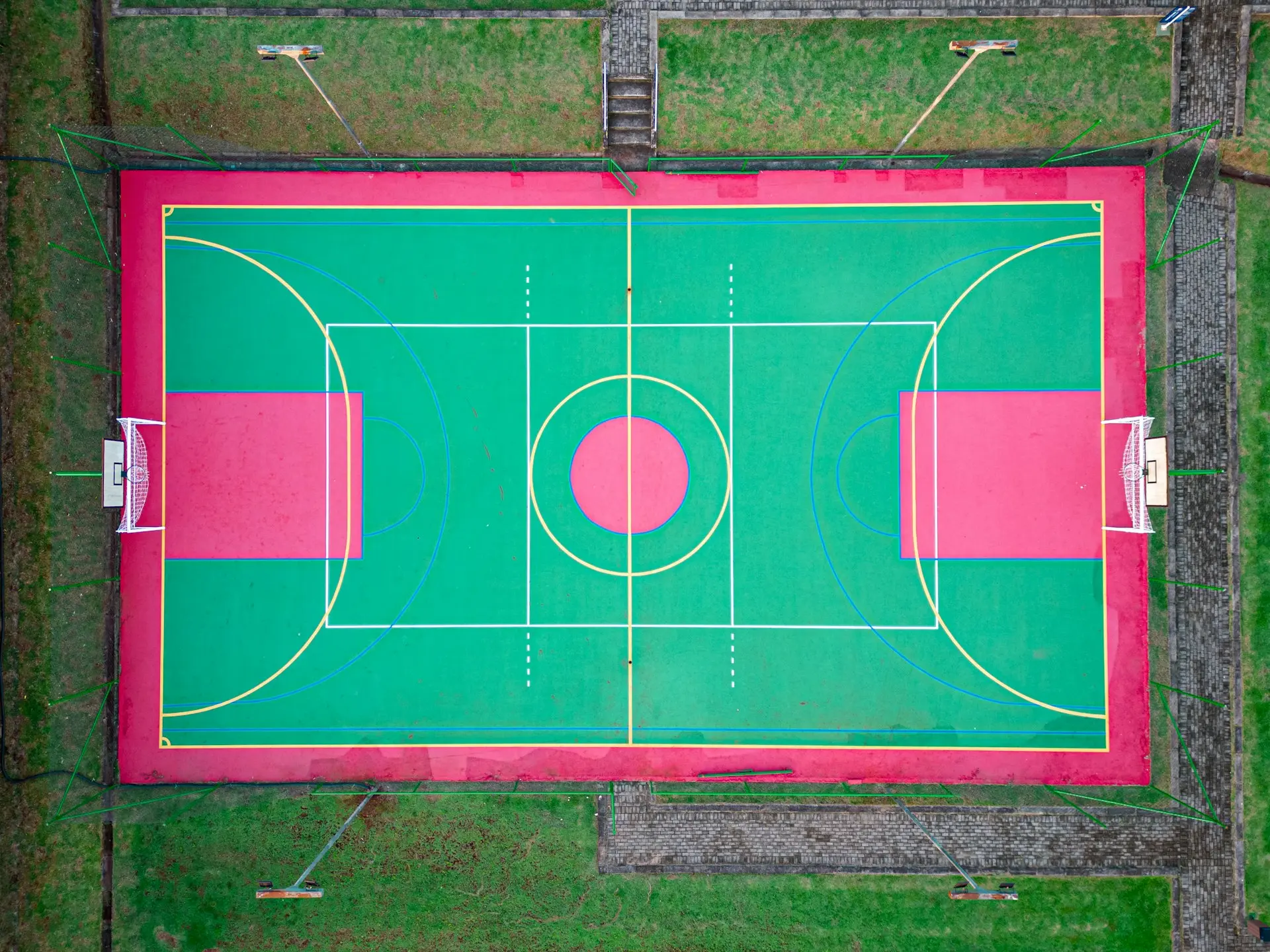 an overhead view of a basketball court in a park